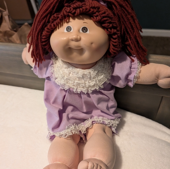 2 Cabbage Patch dolls priced as 1 with several sets of clothes. - Picture 2 of 2